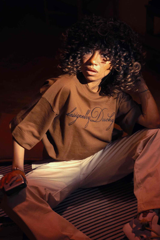 elegantly embroidered, but Brown